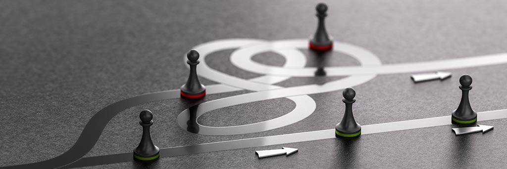 Image of game pieces on path to represent business flexibility