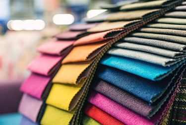 Fabric inventory software with landed cost calculation allocates for all costs associated with acquiring goods.