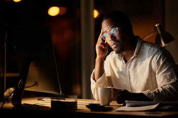 Person contemplating challenges taht can be solved with a QuickBooks ERP integration solution