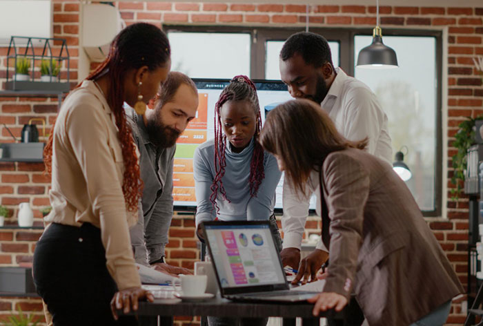 Team of colleagues analyzing data to develop business improvement strategies