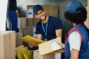 Workers manage order fulfillment with software from our inventory management experts