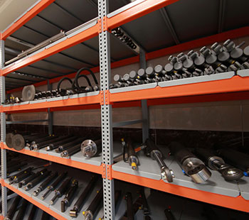 Parts warehouse with shelves of spare parts managed with a parts management system