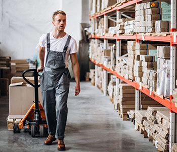 Person working in warehouse to streamline inventory management with a parts management system