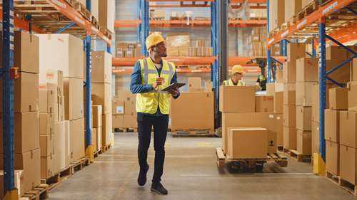 Workers in a warehouse streamline procedures with Acctivate in response to - What does inventory management software do?