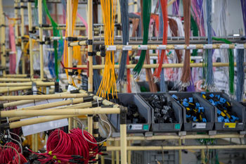 Warehouse with shelves of electrical wires and connectors managed with an ERP system for electrical distributors