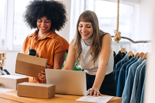 Businesspeople fulfilling orders with an apparel wholesale system