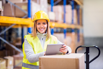 Happy warehouse worker controls inventory with automated inventory counting for accurate inventory
