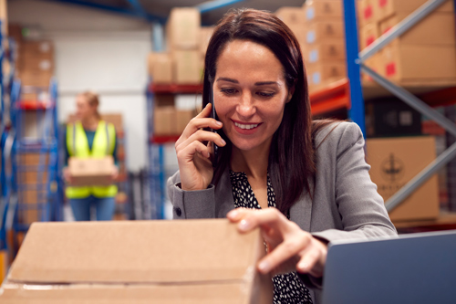 Warehouse worker checking phone order on Acctivate multichannel inventory management