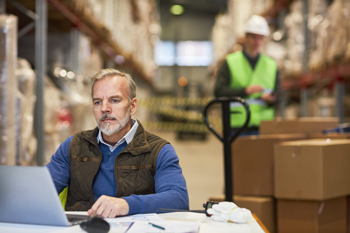 Workers in warehouse streamline operations with multichannel inventory management