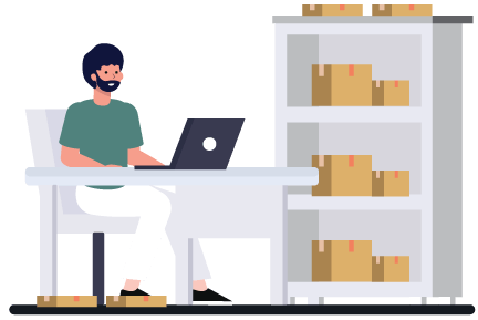 Person on laptop at a desk in a warehouse representing using inventory software to implement an inventory cycle count process
