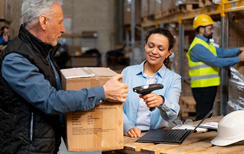 People in warehouse performing picking and packing for order fulfillment