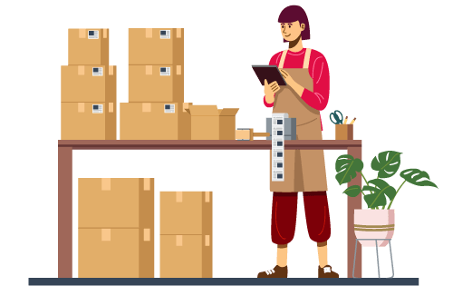 A person at a table with boxes, printing shipping labels representing an inventory business built for success